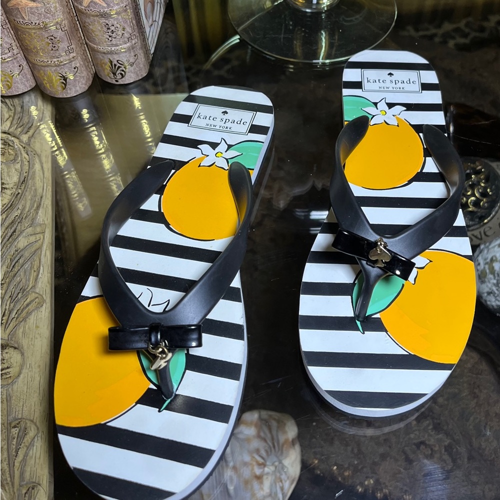 RARE NEW Kate Spade Sandals black/white with oranges print.